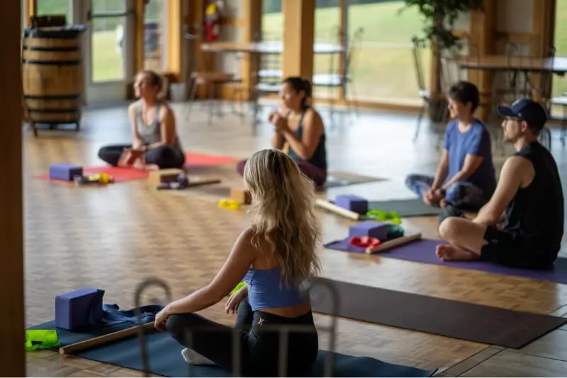 People on the floor doing yoga