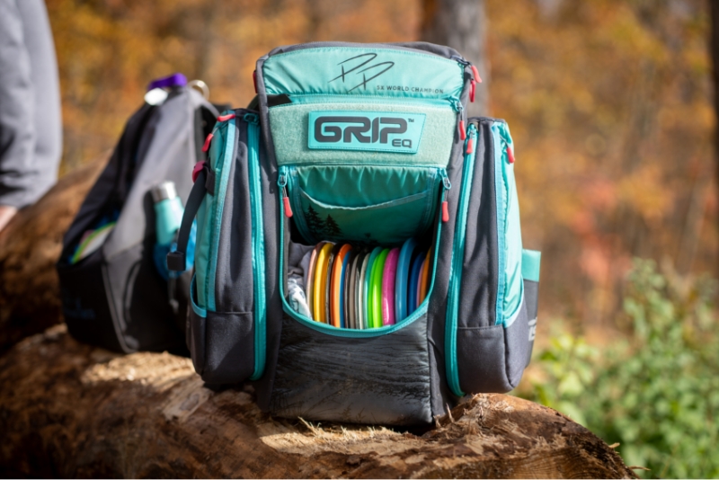 Discs for Disc golf in a turquoise backpack.