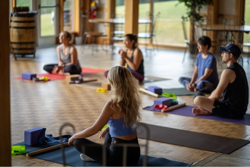 People on the floor doing yoga